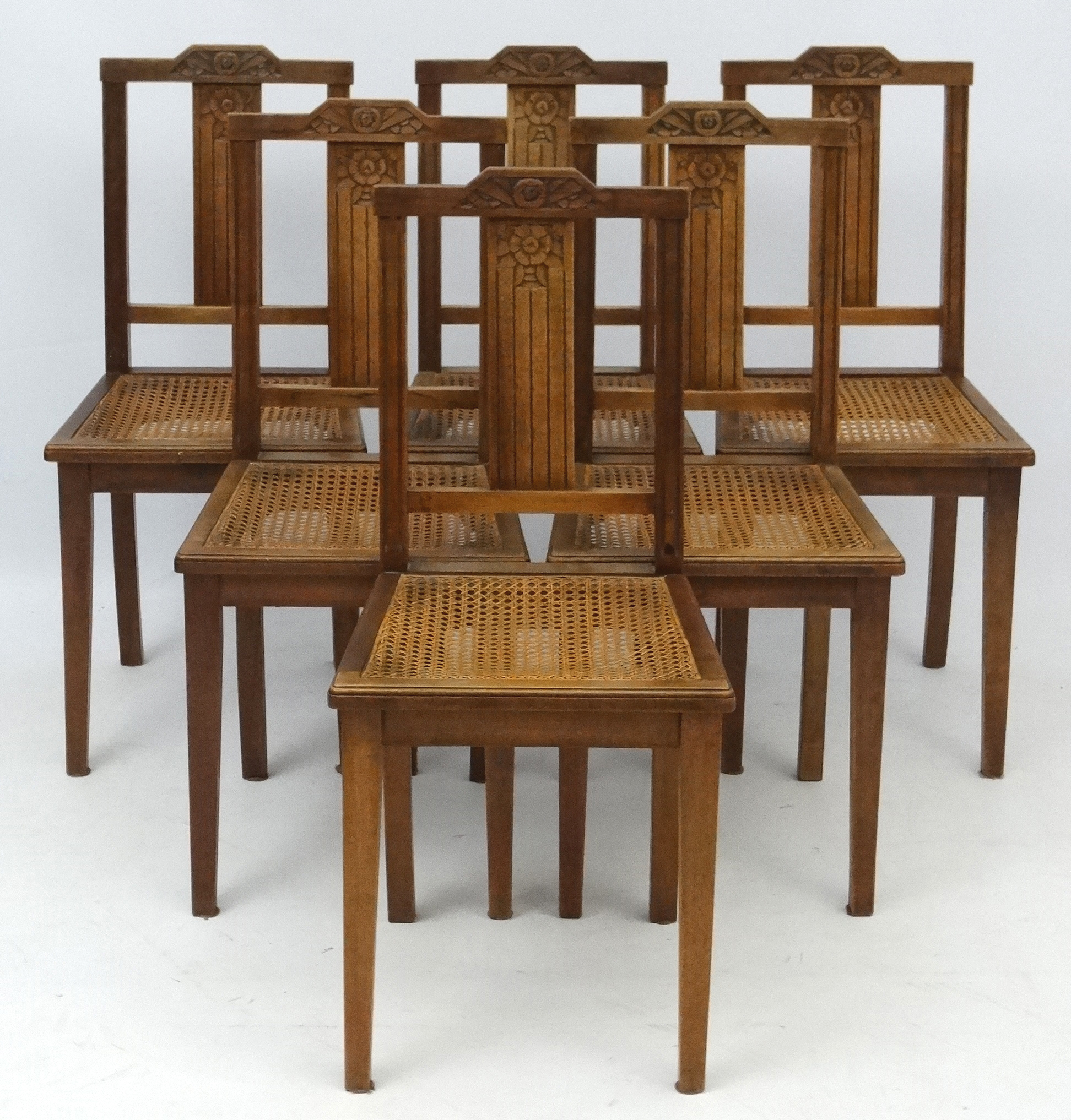 Art Deco : A set of 6 French Walnut Dining chairs with carved back splat and top rail and caned