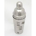 A 21stC silver plated Stainless Steel Cocktail shaker with removable section showing menu