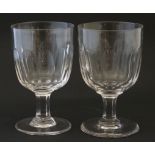 Two clear glass drinking glasses.