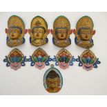 Buddha Heads and adornments : 8 polychrome and gilt decorated cast metal adornments .