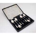 A set of six silver teaspoons together with matching silver sugar tongs hallmarked Birmingham 1933