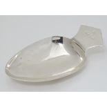 A silver plate large caddy spoon / scoop.