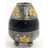 A South American Matté bowl of gourd form with white and yellow metal decoration,