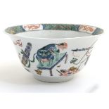 A Chinese famille verte bowl, decorated to sides with Dog of Fo, Hares,