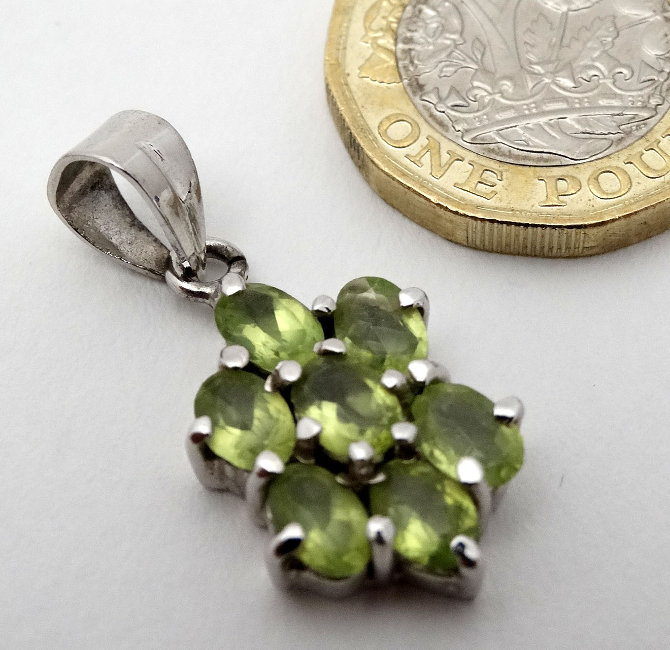 A silver pendant set with pale green stones. - Image 2 of 4