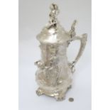 A 21stC large silver plate ewer with art nouveau style decoration and hinged lid 16" high