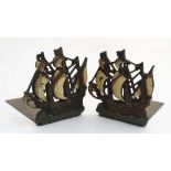 A pair of early - mid 20thC brass and painted cast iron bookends in the form of galleons.