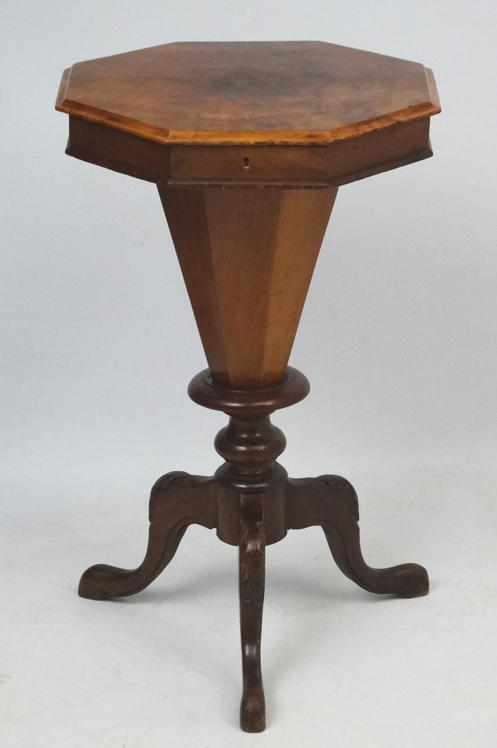 A Victorian walnut sewing table with octagonal top,