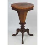 A Victorian walnut sewing table with octagonal top,