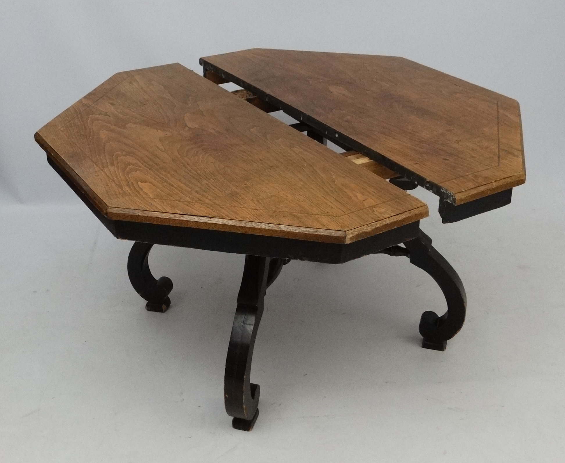 An early 20thC American octagonal oak topped four legged centre table with ebonised base, - Image 3 of 7