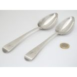 A pair of silver Old English pattern table spoons hallmarked London 1806 maker Solomon Hougham.