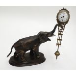 Elephant Clock : a late 20 th C swing pendulum Mantle clock , in the form of an elephant,