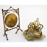 A 19thC brass dinner gong together with a desk inkwell / letter rack.