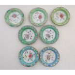 A set of 7 enamel decorated Chinese ashtrays 4 1/4" diameter.