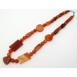 A bead necklace of various agate, cornelian and glass beads.