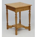 A 20thC Continental stripped pine occasional table with 2 tiers 21 1/3" square x 30" high