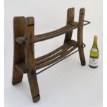 An Artisan made early 20thC croquet stand of oak and wrought iron construction with wooden section