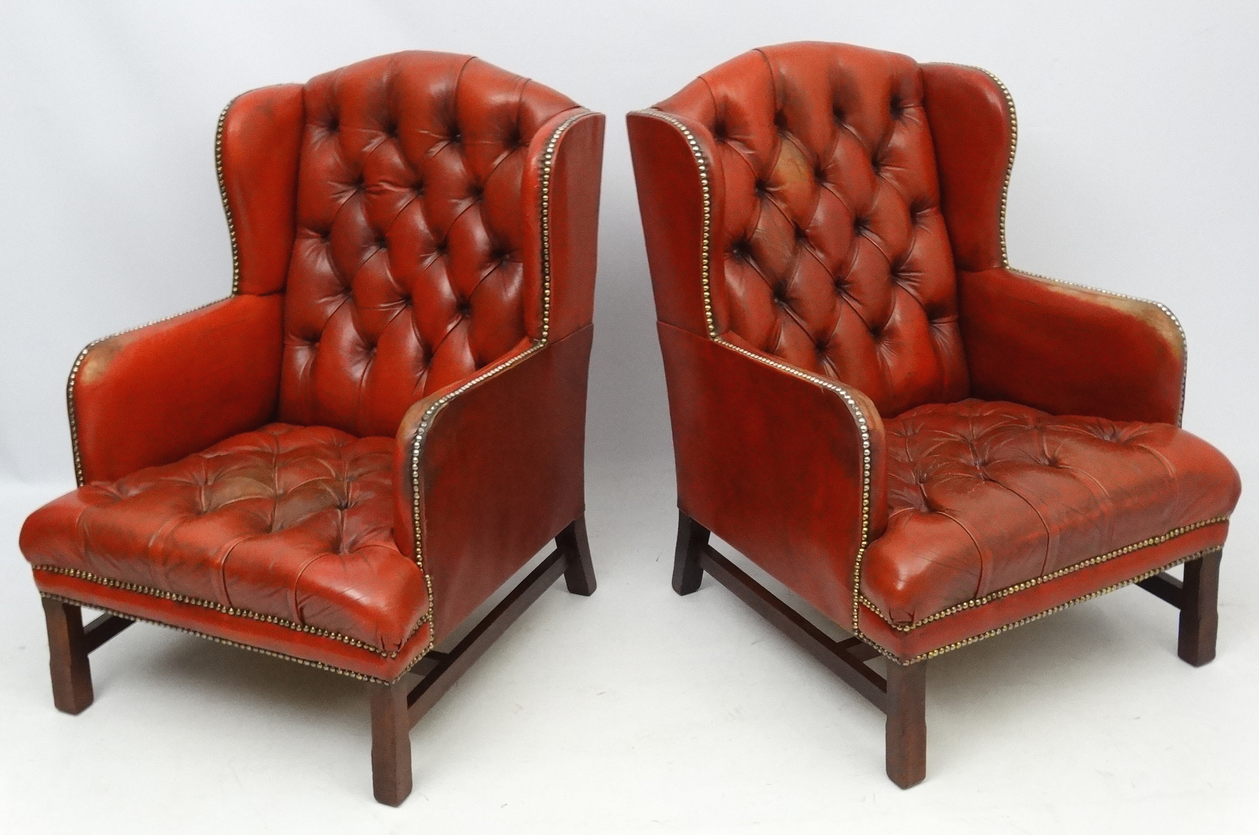 A pair of 20thC red leather wing back armchairs with button back and brass stud decoration 36 1/2" - Image 3 of 5