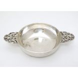 Liberty & Co : A silver plated two handled quaiche, the handles with lizard like decoration.