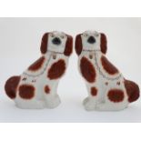 A large pair of 19thC Staffordshire Spaniel dogs in russet and white with gilt lustre collars and