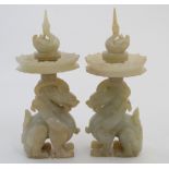 A pair Chinese white jade sconces / candlesticks formed as dragons with lily and drip tray and