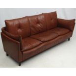 Vintage Retro : A Danish brown leather triple seat sofa , with central button back cushions ,
