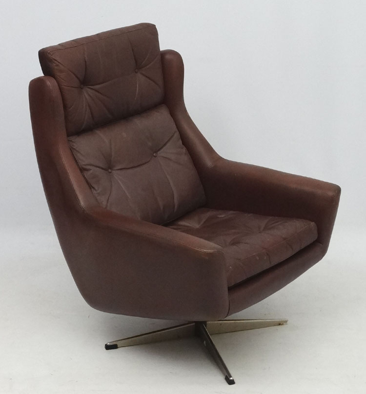 Vintage Retro: A Scandinavian leather swivel wingback armchair in brown leather ,