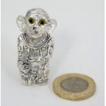 A silver plated novelty pin cushion formed as a monkey. 21stC.