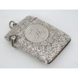 A Victorian silver vesta case with engraved foliate decoration hallmarked Birmingham 1897 1 7/8" x