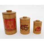 Militaria : A nest of three turned wooden graduated canisters ,