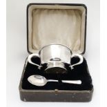 A silver two handled bowl / porringer hallmarked Birmingham 1934 maker Barker Brothers Silver Ltd.