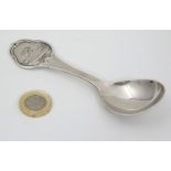 A white metal souvenir spoon marked 'Vejen' 5 1/4" long CONDITION: Please Note -