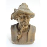 A carved Austrian limewood? figure of a Tyroleon gentleman, bears remains of polychrome decoration.