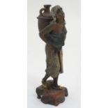 A c.1900 cold painted lead polychrome figure of a female figure carrying an amphora.