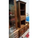 2 items of oak veneerer furniture to include a 2 door low cabinet and 2 drawer shelf unit