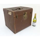 An early 20thC canvas and leather squared travelling trunk / hatbox with brass fitments marked D.