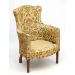 A late Victorian shaped back armchair with walnut show wood 36 1/2" high CONDITION: