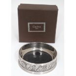 A silver plated coaster with grape vine decoration cased CONDITION: Please Note -