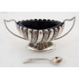 A Victorian silver twin handled salt with fluted and acanthus scroll decoration,