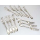 A matched set of 12 silver fiddle thread and shell pattern table forks : Comprising a set of 11