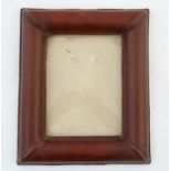 A large cushion moulded leather photograph frame, probably Italian.