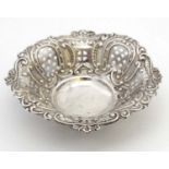 A silver bon bon dish with embossed and pierced decoration hallmarked Birmingham 1909 maker H J
