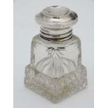 A cut glass salts / scent jar with silver lid hallmarked Birmingham 1914 maker A J Pepper & Co.