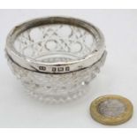 A cut glass salt with silver rim hallmarked Birmingham 1903 maker Albert Sydenham.