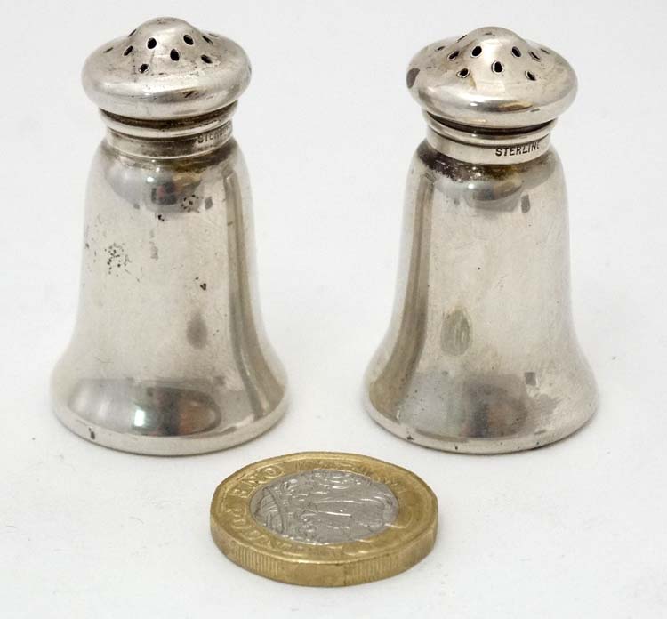A pair of American silver pepperettes marked 'Sterling' maker Gorham Manufacturing Company 1 3/4"