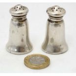 A pair of American silver pepperettes marked 'Sterling' maker Gorham Manufacturing Company 1 3/4"