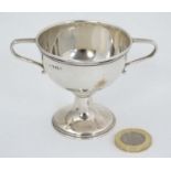A small silver trophy with twin handles engraved ' St Marks Club Lades T.T Final 1943/4 R.Up.