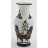 A black and white Chinese vase decorated with pagodas, trees and mountains in shades of black,