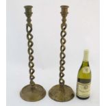 A pair of cast brass double opentwist candlesticks standing 20 3/4" high CONDITION: