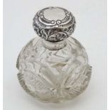 A cut glass scent / perfume bottle with hinged top hallmarked Chester 1906 maker Martin, Hall & Co.